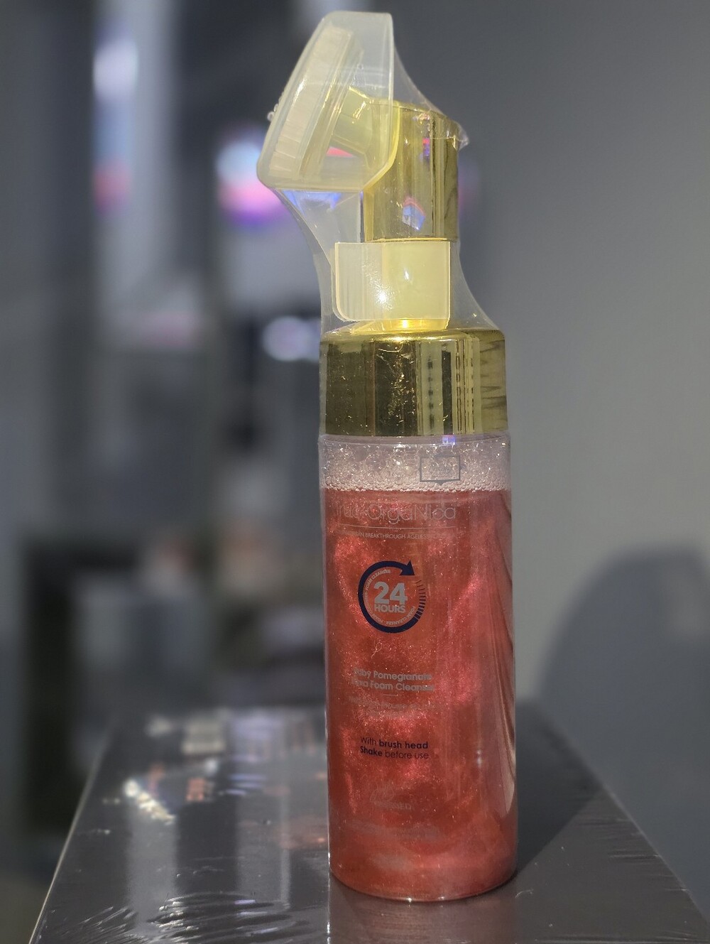True Organica Foaming Facial Cleanser with built-in brush applicator.
